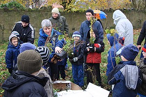 Lisa Bintliff hands out the tree packs